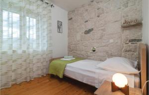 Posteľ alebo postele v izbe v ubytovaní Three-Bedroom Holiday Home In Podgrade