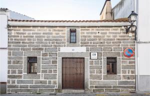 a brick building with a door and two windows at Amazing Home In Añora With Wifi in Anora