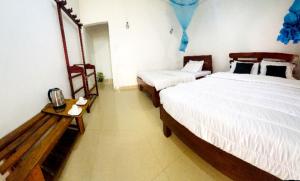 Uma cama ou camas num quarto em The kiwi