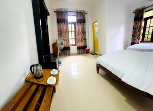 Uma cama ou camas num quarto em The kiwi