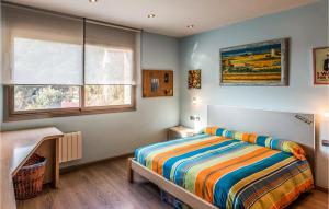 A bed or beds in a room at Lovely Home In Sant Cebrià De Vallalta