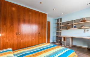 A bed or beds in a room at Lovely Home In Sant Cebrià De Vallalta