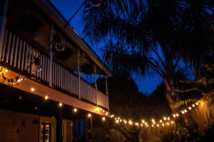 a string of lights on the side of a building at Elysian Fields Inn in New Orleans