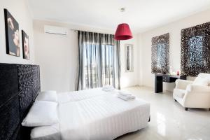 Posteľ alebo postele v izbe v ubytovaní Kronos Villas