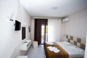Postel nebo postele na pokoji v ubytování Hotel Maria