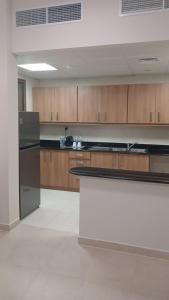 Kuchyň nebo kuchyňský kout v ubytování P one Hotel apartment