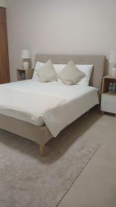 Postel nebo postele na pokoji v ubytování P one Hotel apartment
