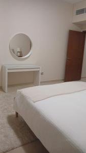 Postel nebo postele na pokoji v ubytování P one Hotel apartment