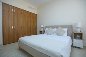 Postel nebo postele na pokoji v ubytování P one Hotel apartment