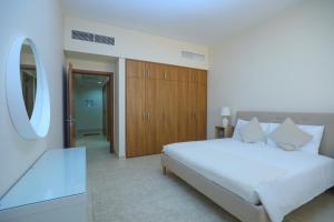 Postel nebo postele na pokoji v ubytování P one Hotel apartment