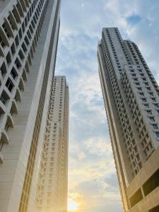 two tall buildings are next to each other at Stellarlux Apartment, 35th floor in Skopje