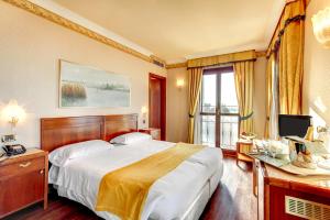 Łóżko lub łóżka w pokoju w obiekcie Hotel Panorama