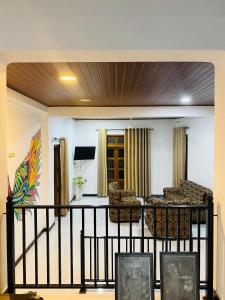 a living room with chairs and a table at Enara Luxury Stay in Katugastota