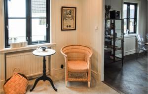 a room with a chair and a table and window at Awesome Home In Mörrum With Wifi in Mörrum