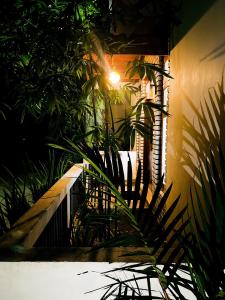 a house with plants and a light on a wall at Enara Luxury Stay in Katugastota