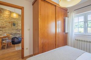 A bed or beds in a room at Casa Playa de Balares
