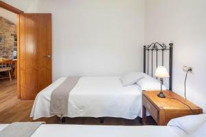 A bed or beds in a room at Casa Playa de Balares