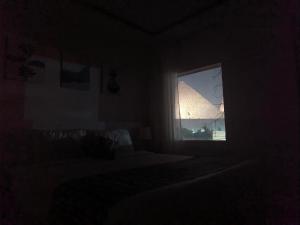 Letto o letti in una camera di Maria Pyramids House