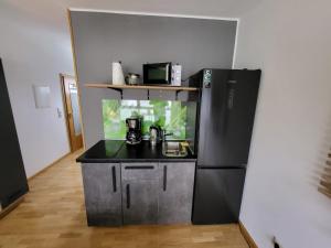 Η κουζίνα ή μικρή κουζίνα στο Ferienwohnung Sonnenschein nahe Messe Nürnberg +7 φωτογραφίες