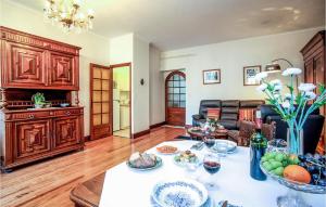 a living room with a table with glasses of wine at Les 3 Oies in Sarlat-la-Canéda +9 photos