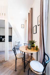 a dining room with a table and chairs at Silvie Apartments - Vídeňská in Olomouc