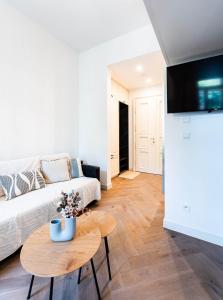 a living room with a couch and a table at Silvie Apartments - Vídeňská in Olomouc