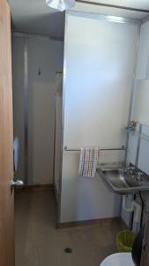 a bathroom with a sink and a shower and a toilet at Widgiemooltha Caravan Park in Widgiemooltha +23 photos