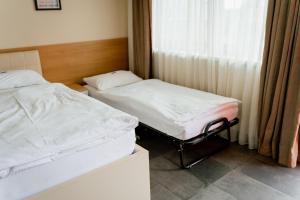 Voodi või voodid majutusasutuse Nava Motel SELF CHECK-IN toas