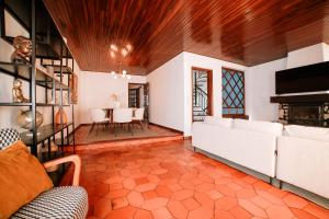 a living room with a couch and a table at Casa da Laranja by Quantique in Peso da Régua +46 photos