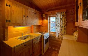 a kitchen with a sink and a stove at 5 Bedroom Pet Friendly Home In Jordet in Jordet