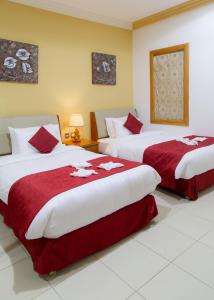 Cama o camas de una habitación en Al Liwan Residence
