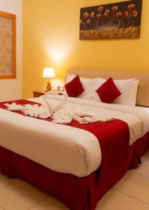 Cama o camas de una habitación en Al Liwan Residence