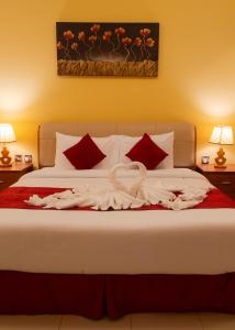Cama o camas de una habitación en Al Liwan Residence