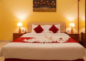 Cama o camas de una habitación en Al Liwan Residence