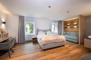 Voodi või voodid majutusasutuse Hotel Gasthof Brüggler toas