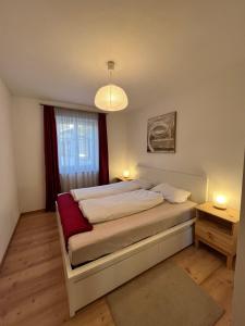 Postel nebo postele na pokoji v ubytování Für 4-6 Wohnhaus im Weinberg - Voldersberghof