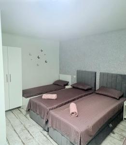 Postel nebo postele na pokoji v ubytování AmA