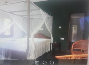 Postel nebo postele na pokoji v ubytování Sunil Garden Guesthouse