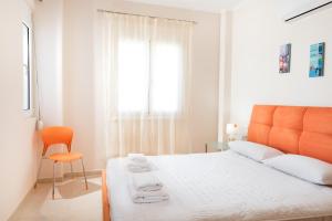 Posteľ alebo postele v izbe v ubytovaní Kronos Villas