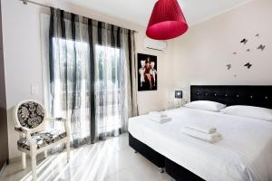 Posteľ alebo postele v izbe v ubytovaní Kronos Villas