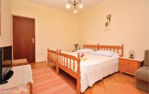 Posteľ alebo postele v izbe v ubytovaní Apartment Jelsa 08