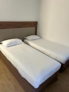 Postel nebo postele na pokoji v ubytování Kyriad Direct Metz Nord – Woippy