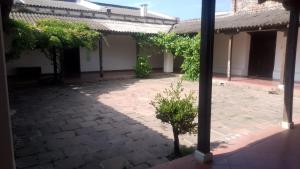 an outside view of a courtyard with a building at La Casona del Norte Jujuy in San Salvador de Jujuy