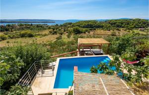 una imagen de una villa con piscina en Lovely Home In Banjol With Sauna, en Banjol
