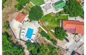 an overhead view of a yard with a house and trees at Holiday Home Zmijavci I in Zmijavci +34 photos