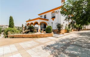 a large white building with an orange roof at Stunning Home In Aguilar De La Frontera in Aguilar de la Frontera