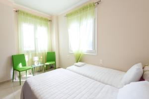 Posteľ alebo postele v izbe v ubytovaní Kronos Villas