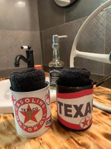 two coffee cups sitting on a counter in a bathroom at Le Vintage Loft Garage in Saint-Agnan-sur-Loire +30 photos