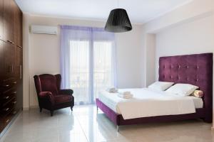 Posteľ alebo postele v izbe v ubytovaní Kronos Villas
