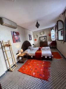 Postel nebo postele na pokoji v ubytování Auberge RIAD DLIM Tamraght